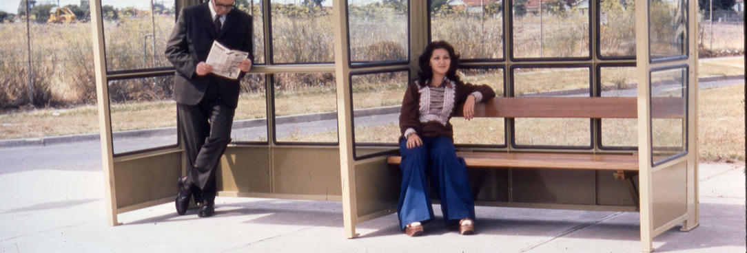 Woman sits at bus stop VPRS12907P4Unit7